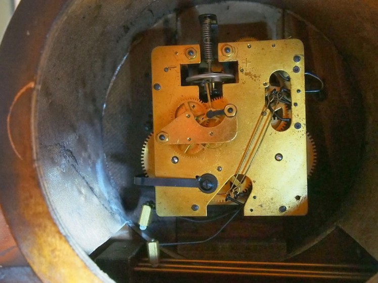 Dugena clock movement showing floating balance escapement