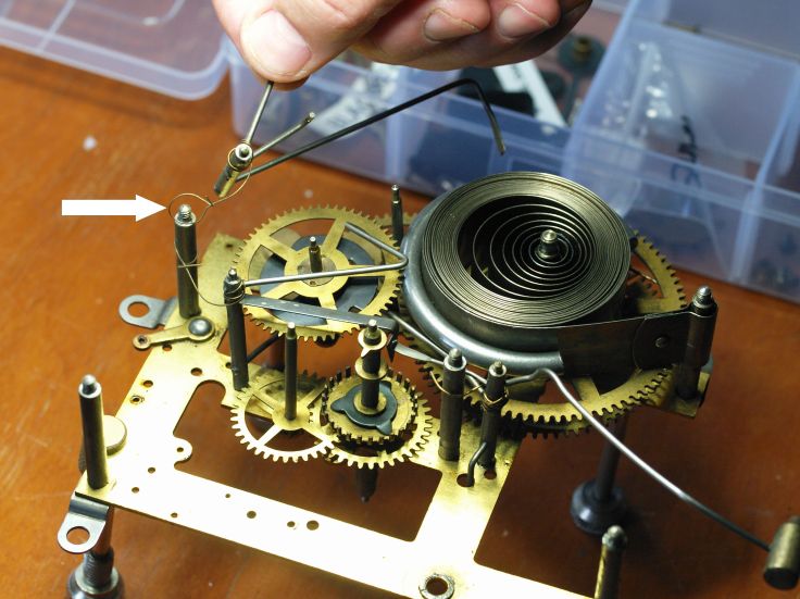 Removing lever with helper spring