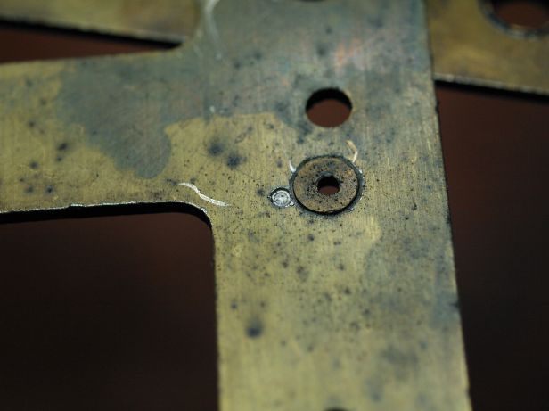 punch mark next to a bushing