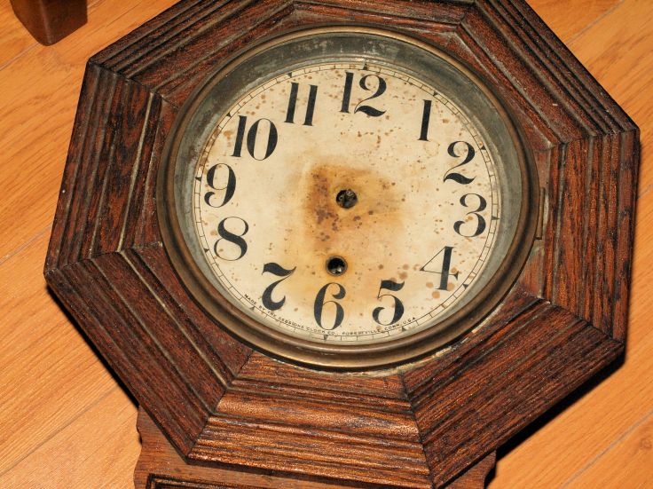 clock face showing rust staining