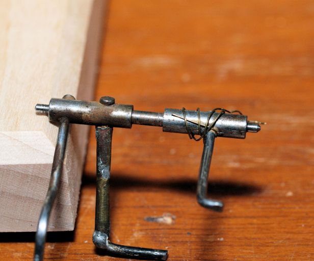 Strike side maintenance lever