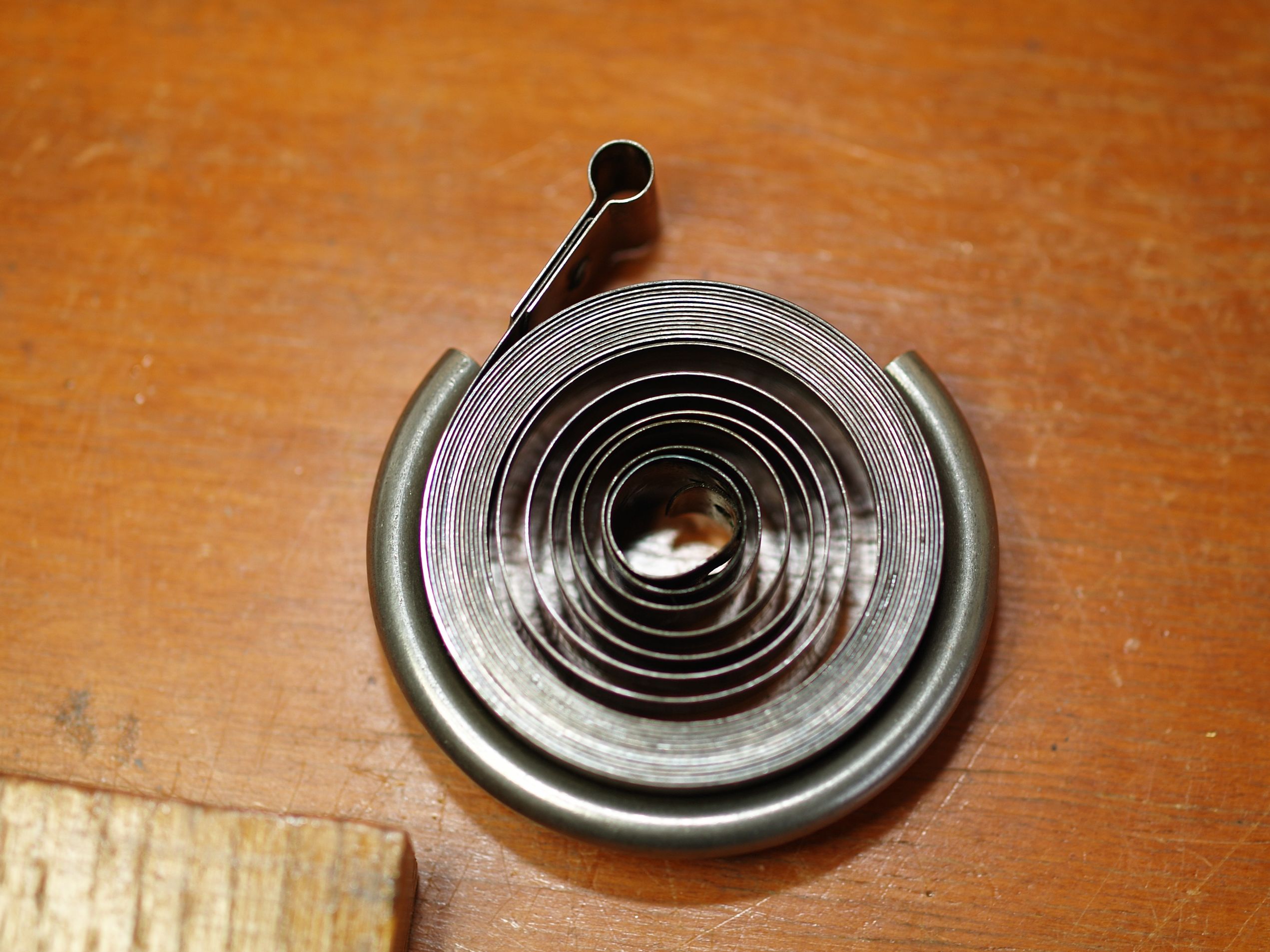 Mainspring contained in a clamp