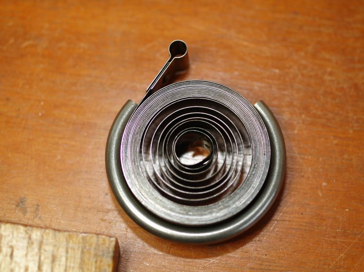 Mainspring contained in a clamp