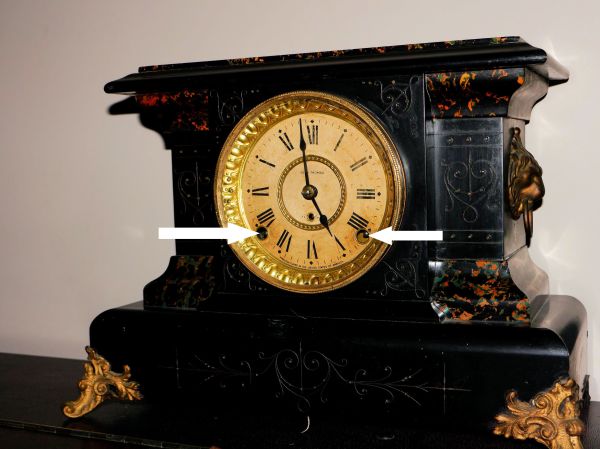 Winding arbors on a Seth Thomas mantel clock (arrows)