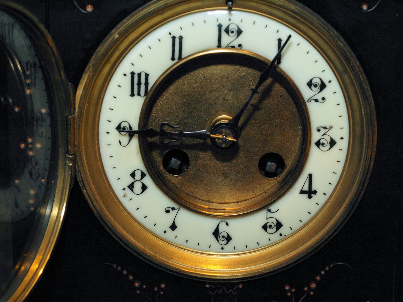 Clock face showing the two winding arbours