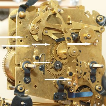 Arrows show new bushings and a newer click spring