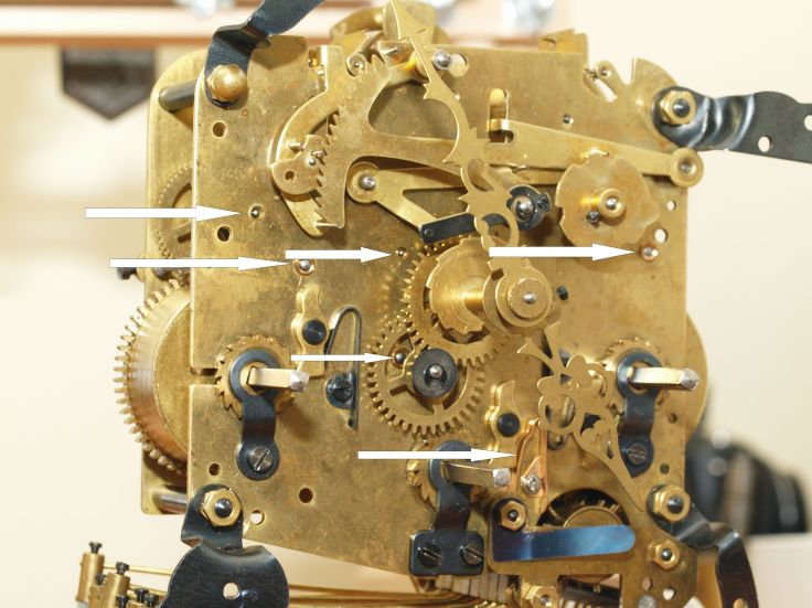 Arrows show new bushings and a newer click spring