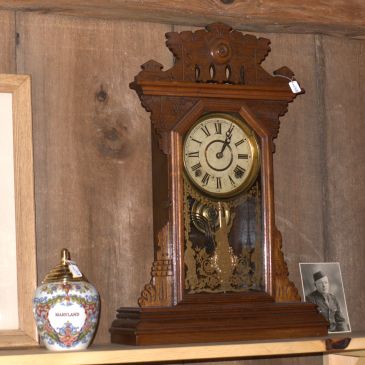 Clock displayed in antique shop