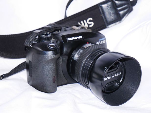 8 megapixel E330 with 50mm F2 lens, introduced in 2006; first DSLR with "Liveview"
