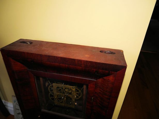 Ogee clock top showing cable pulleys