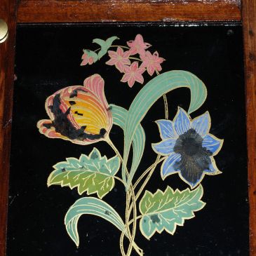 Lower tablet shiowing reverse paintiung of flowers