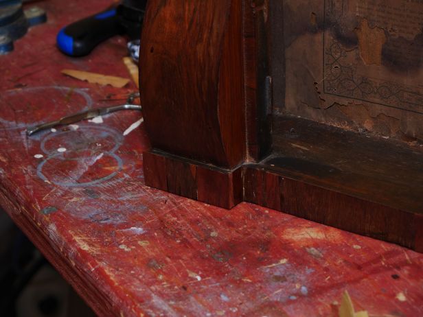 Most of the base was replaced with new veneer