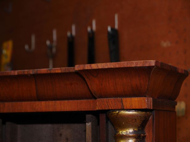 New veneer above cornice, base of cornice is original though it looks like it was replaced