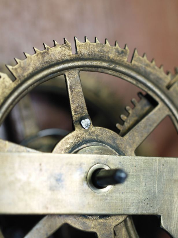 Retainer clip for count wheel riveted in place