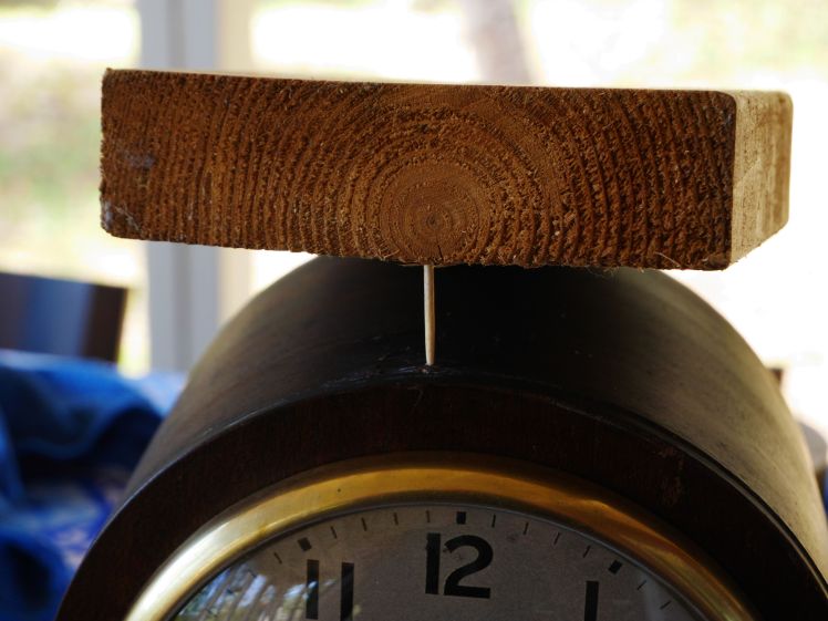 Toothpick and wood piece to push the veneer in