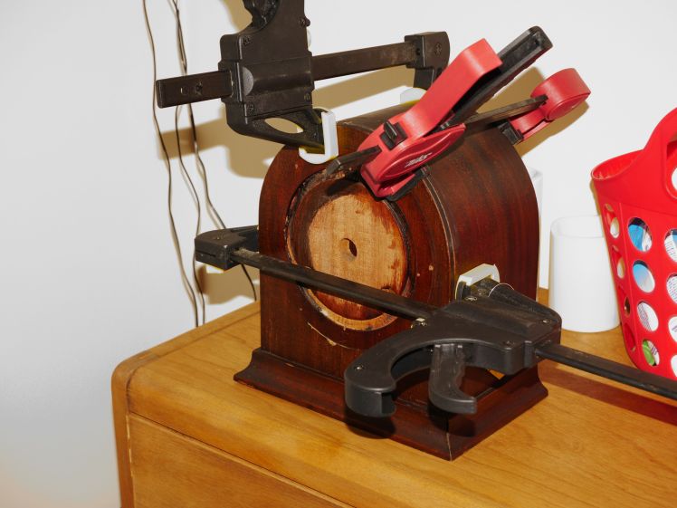 Using three clamps to bring the sides together and the front section into the case