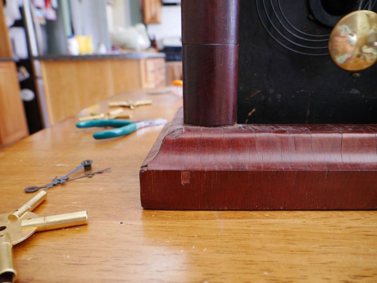 Veneer chips on left side of base