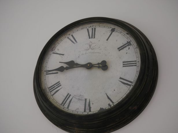 Unknown gallery clock. I could not find an opening on this clock. No arbor holes on the clock face.