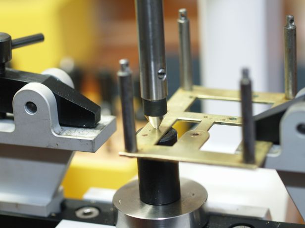 Centering prior to drilling a hole for a bushing