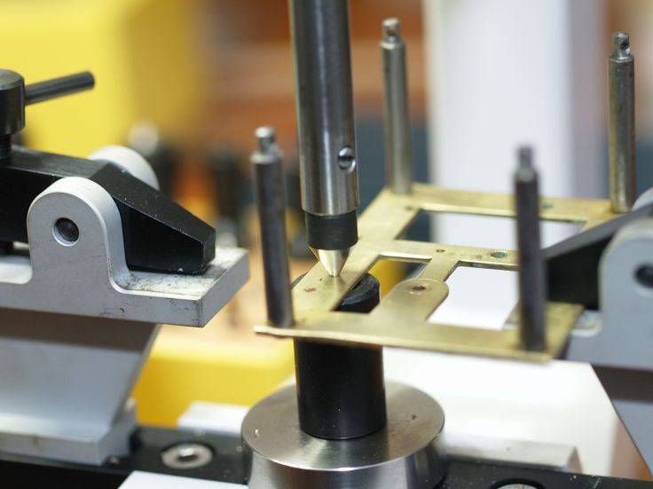 Centering prior to drilling a hole for a bushing