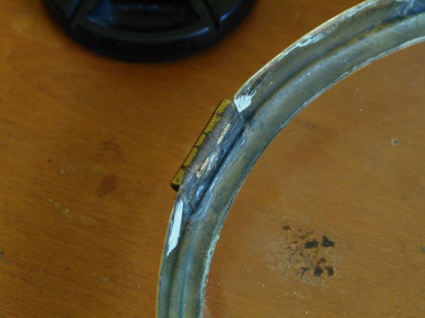 7/8 inch hinge is soldered back into the bezel