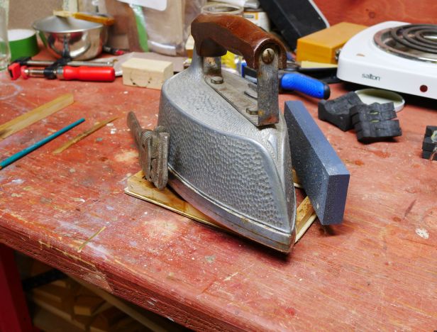 Glued (Hide Glue) and weight placed on moulding and frame