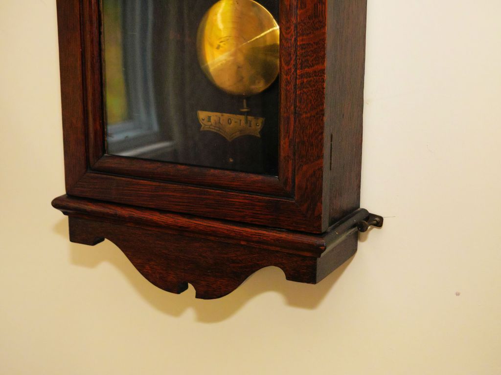 The lower portion of the Arthur Pequegnat Moncton 15-day wall clock