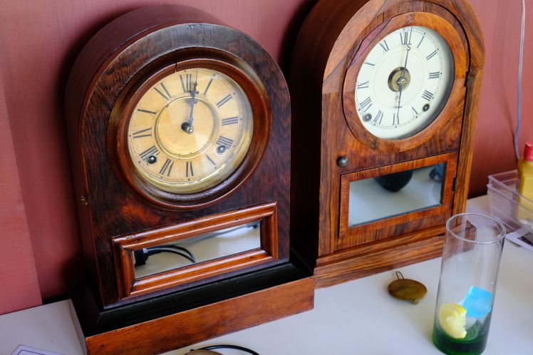 Jerome and Seth Thomas round top clocks side by side
