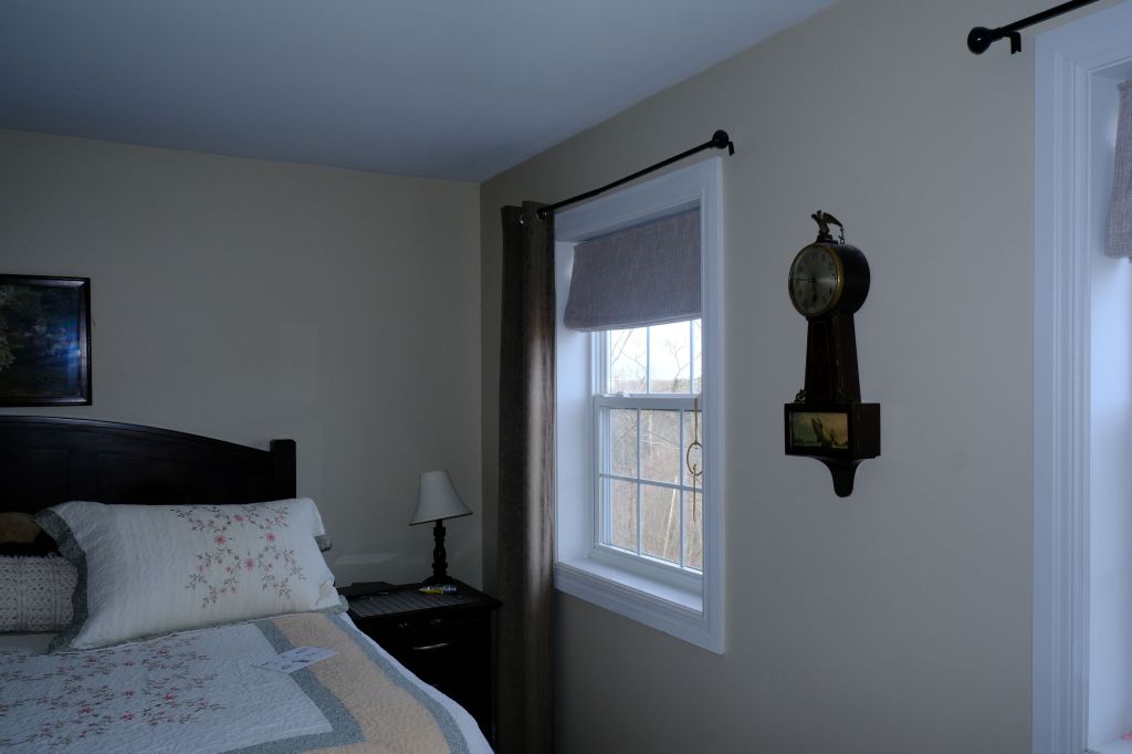 Clock on a wall in a bedroom