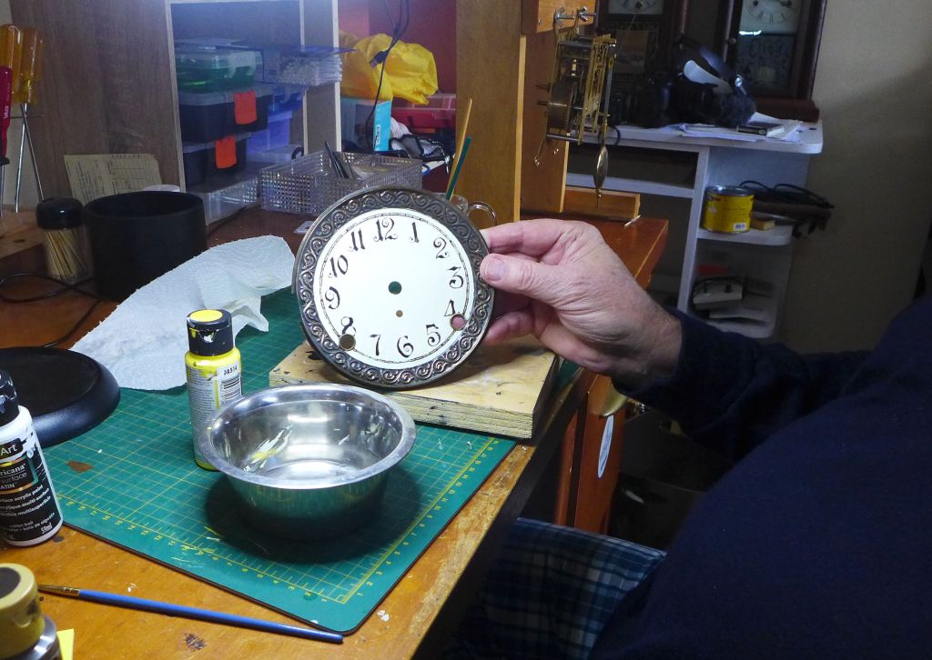 Writer presenting the clock dial after a 3rd coat